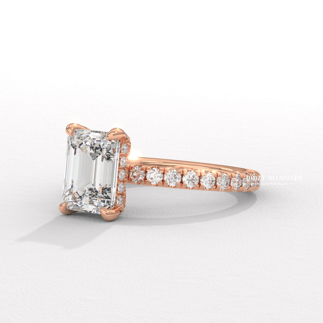 Fine craftsmanship detail on emerald hidden halo engagement ring