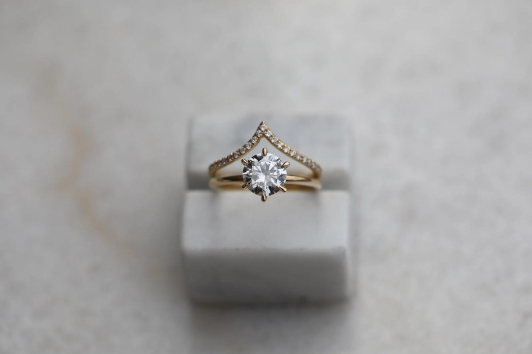 Angled view of round cut diamond in solitaire setting