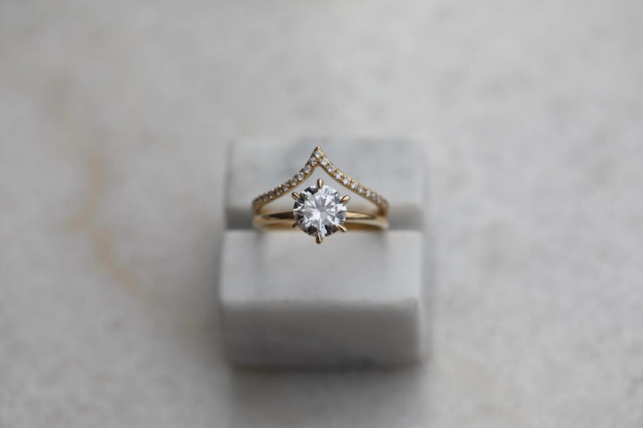 Angled view of round cut diamond in solitaire setting