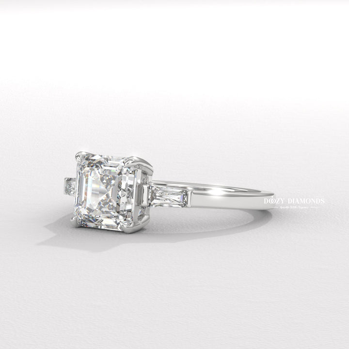 Asscher three stone engagement ring viewed from the side