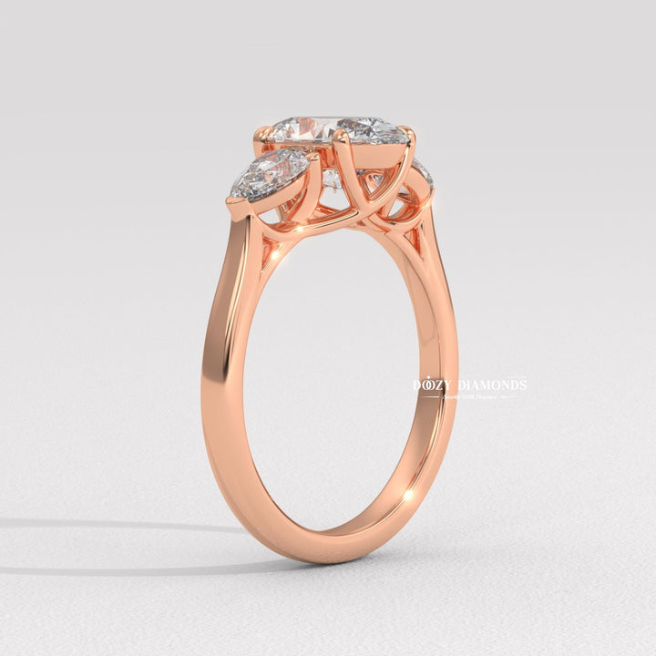 Oval three stone engagement ring shown on hand for true-to-life sizing