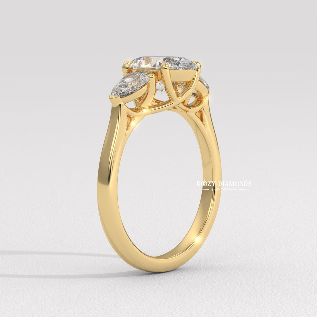 Close-up of oval cut center diamond in three stone engagement ring