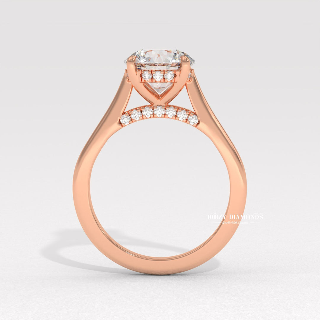 Round hidden halo engagement ring shown on hand for true-to-life sizing