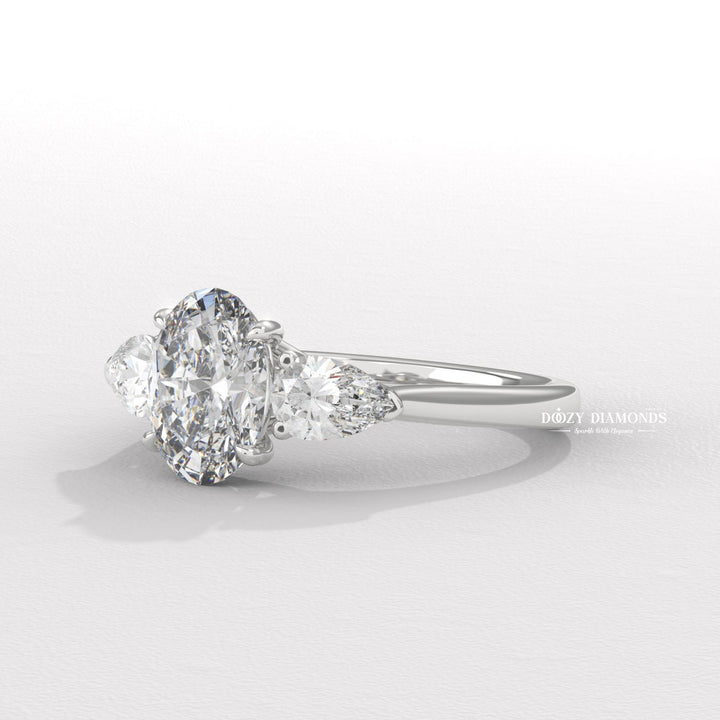 Profile view of oval cut three stone engagement ring band