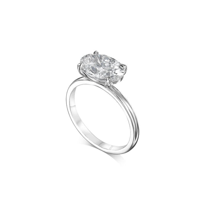 Oval cut diamond ring worn on hand