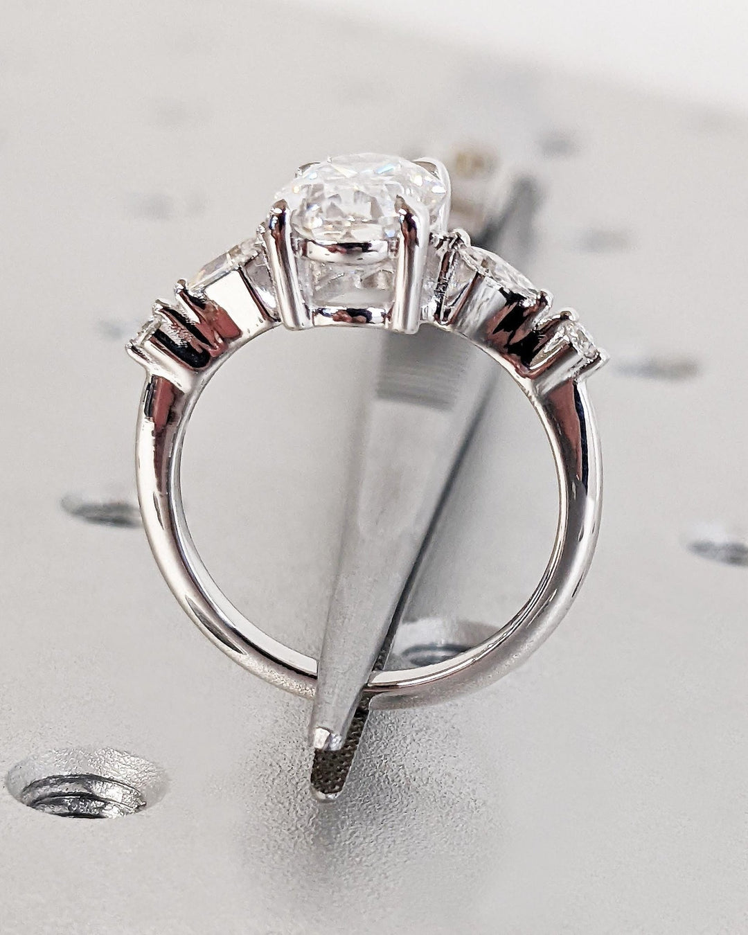 Oval cluster engagement ring offered in gold and platinum