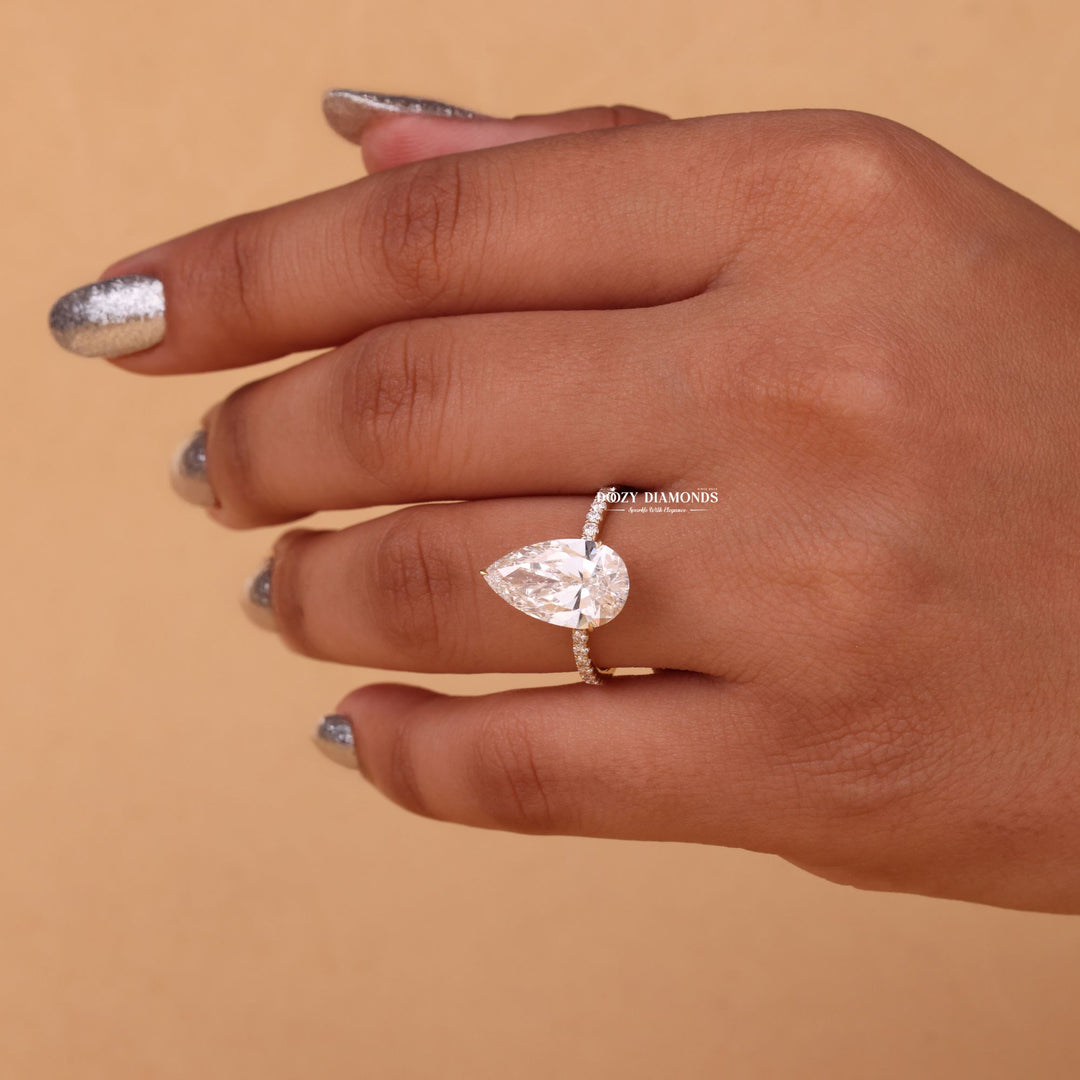 Pear hidden halo lab grown diamond ring side profile in gold setting