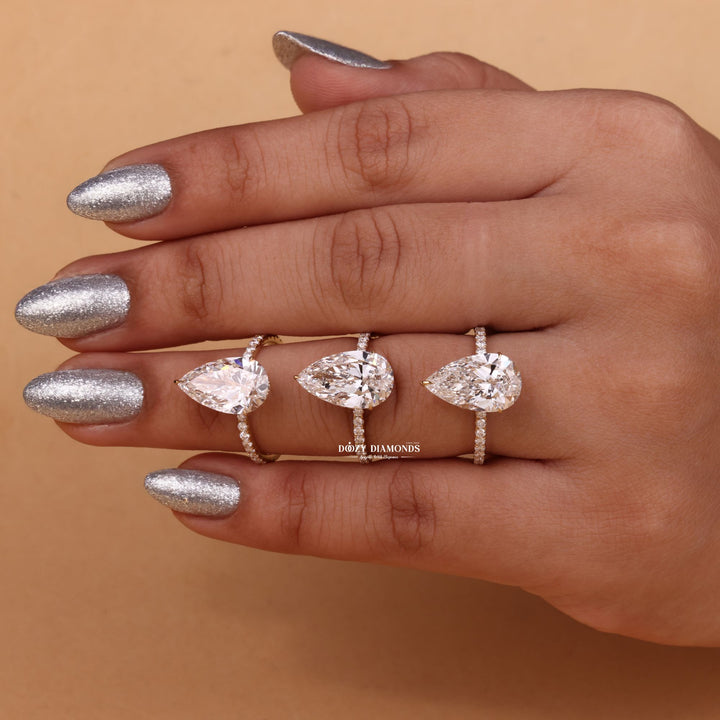 Pear cut diamond ring worn on hand