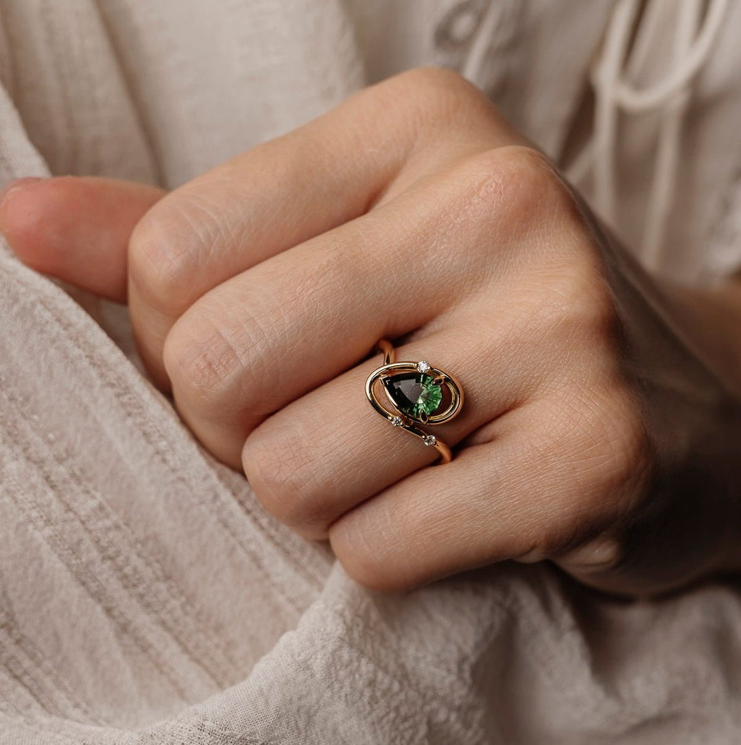 Pear solitaire engagement ring close-up showing high clarity diamond clarity