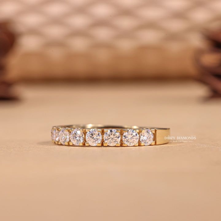 Round diamond band stacked with engagement ring