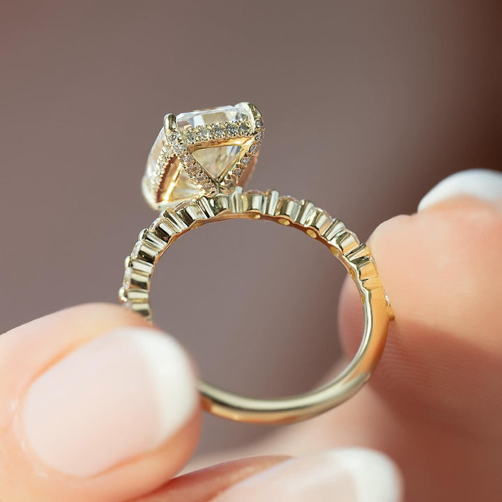 Certified cushion cut diamond featured in pave engagement ring