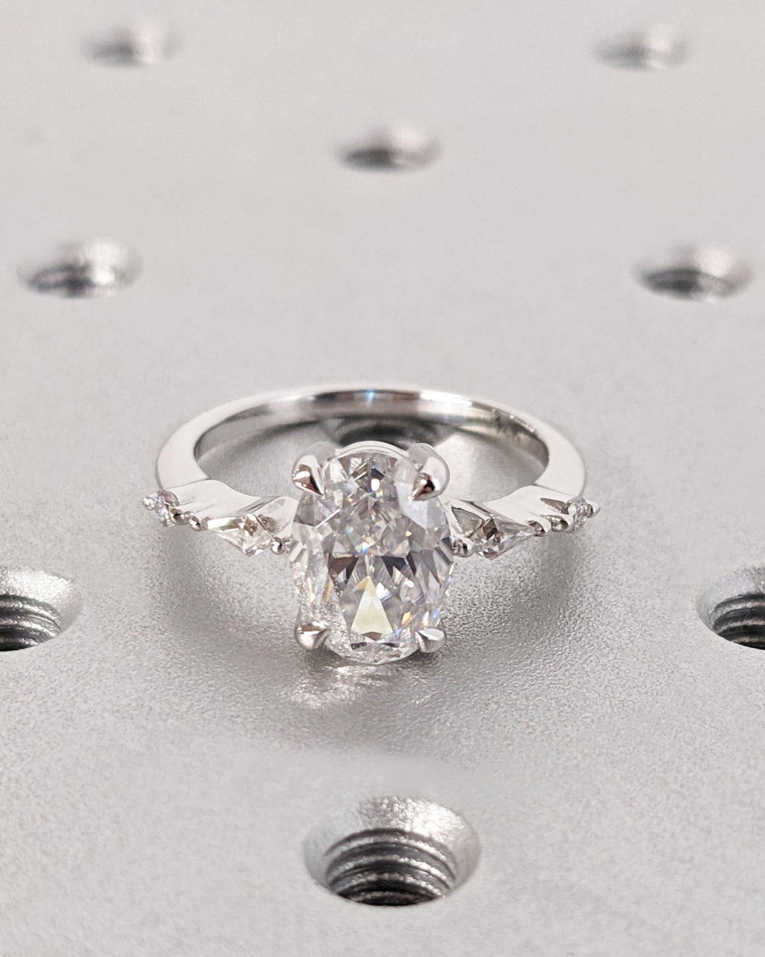 Oval cluster diamond ring presented in signature gift packaging