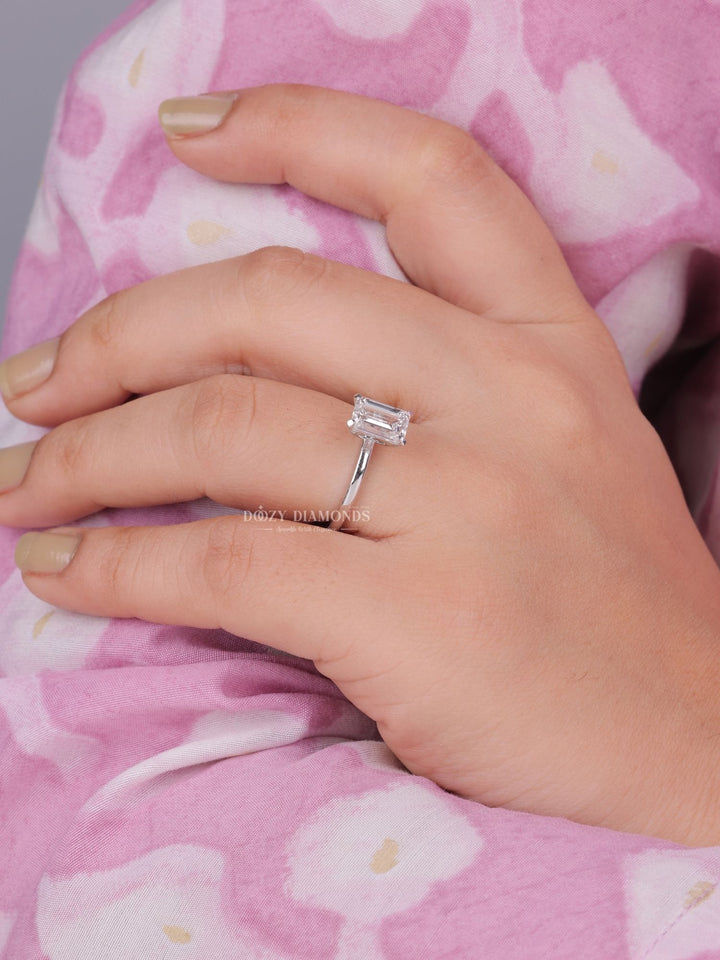 Macro shot of emerald cut diamond facets in solitaire ring setting