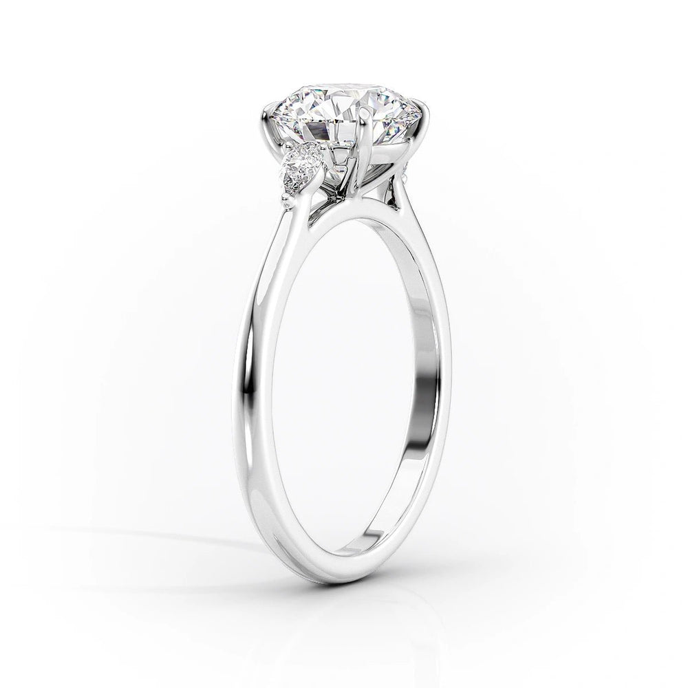 Lifestyle shot of oval three stone diamond ring on hand