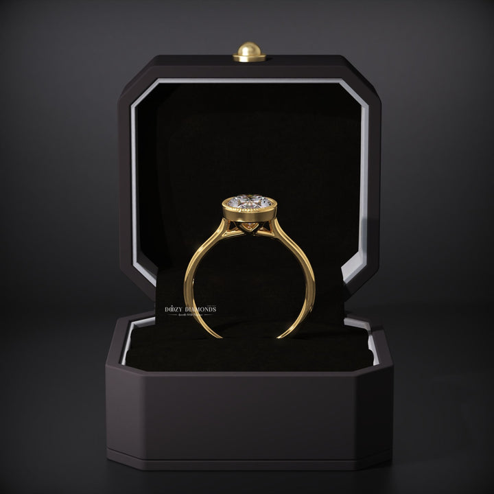 Oval bezel engagement ring with certified lab grown diamond