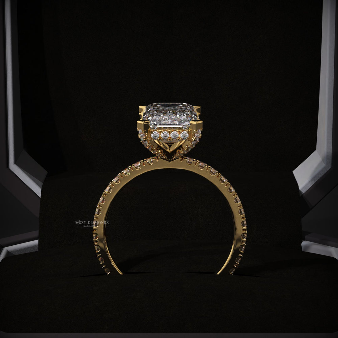 Emerald hidden halo engagement ring photographed in natural light