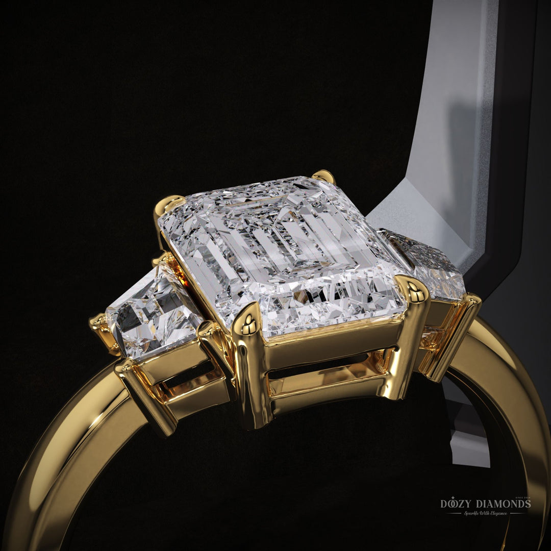 Lifestyle shot of emerald three stone diamond ring on hand