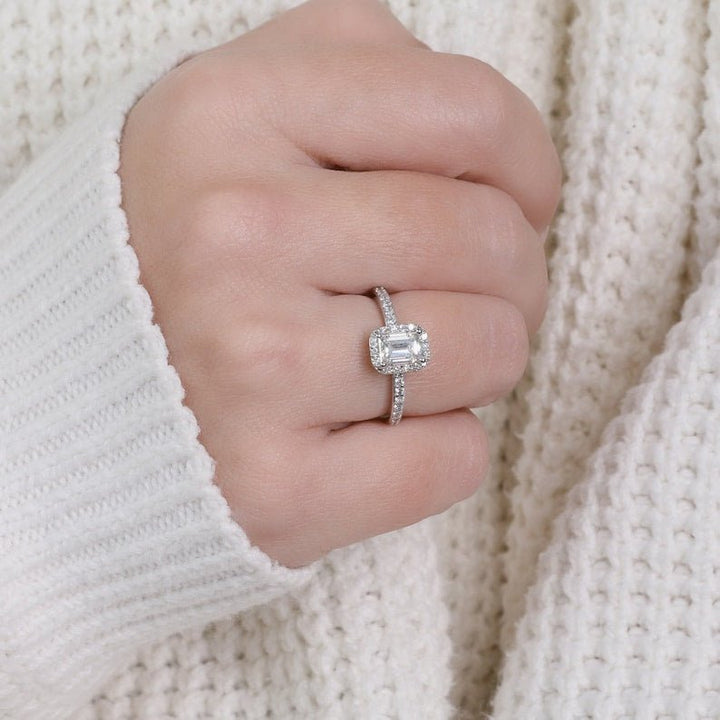Emerald cut halo engagement ring with IGI certified center diamond