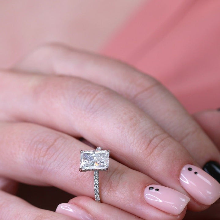 Radiant hidden halo engagement ring viewed from the side