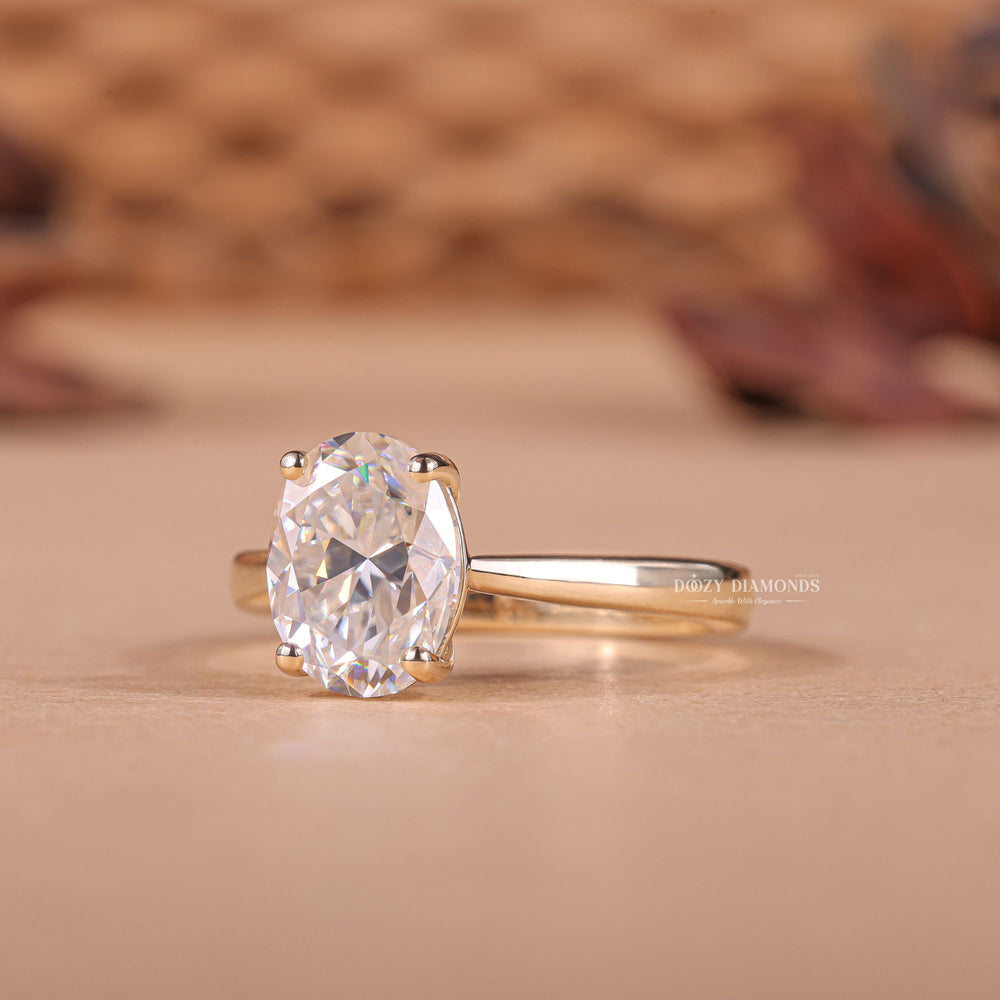 Close-up of oval cut center diamond in solitaire engagement ring