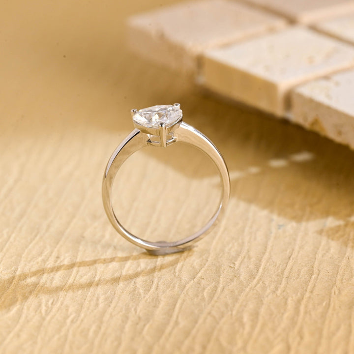 Heart solitaire engagement ring offered in gold and platinum