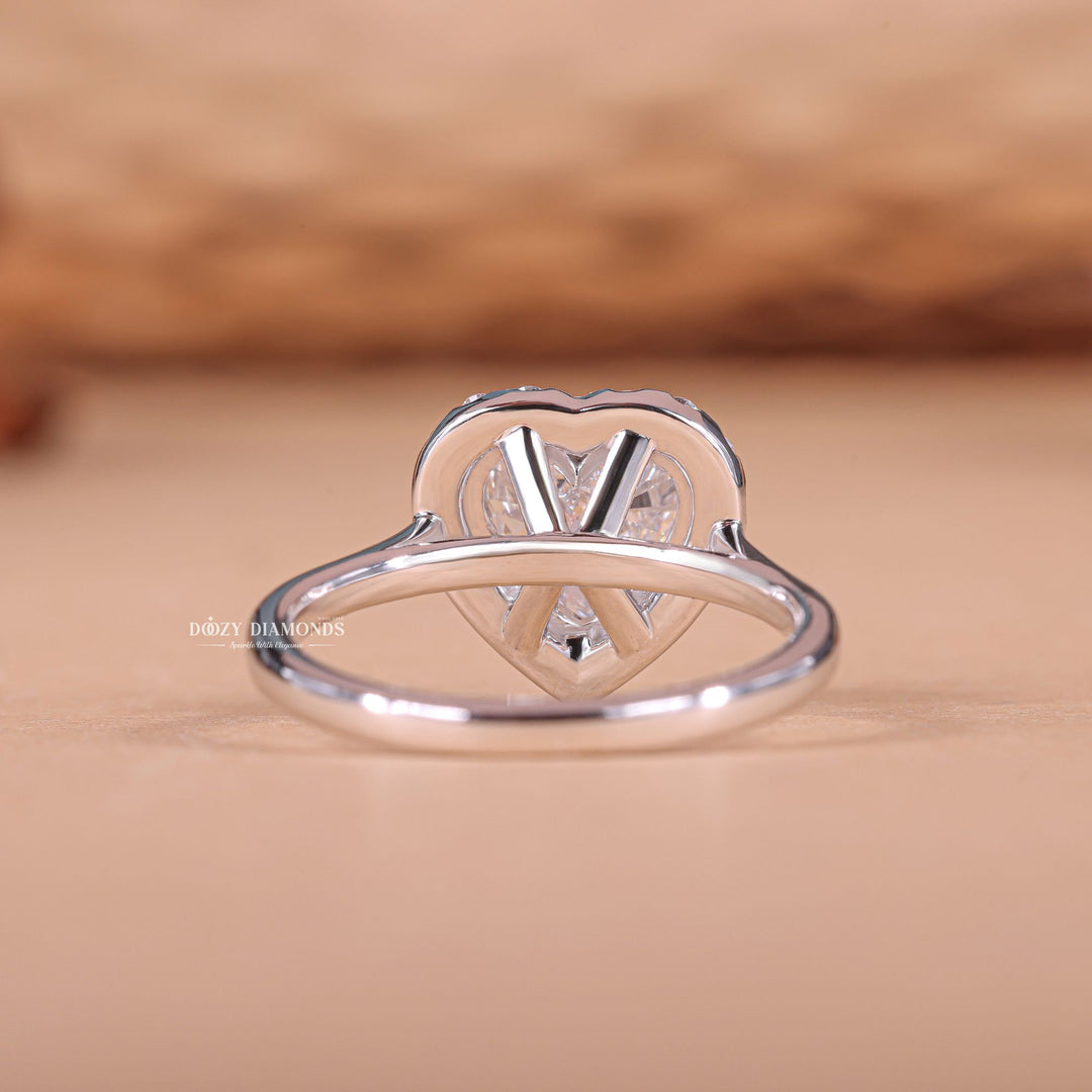 Lifestyle shot of heart halo diamond ring on hand