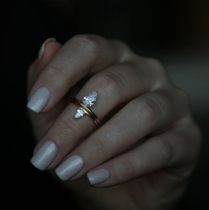 Pear solitaire engagement ring with brilliant diamond sparkle