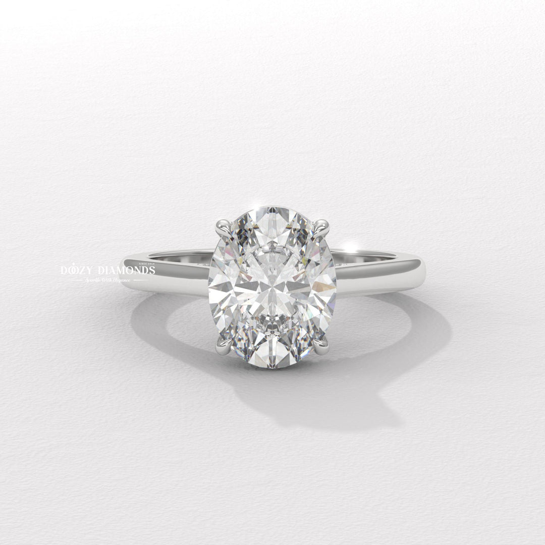 Close-up of oval cut center diamond in solitaire engagement ring
