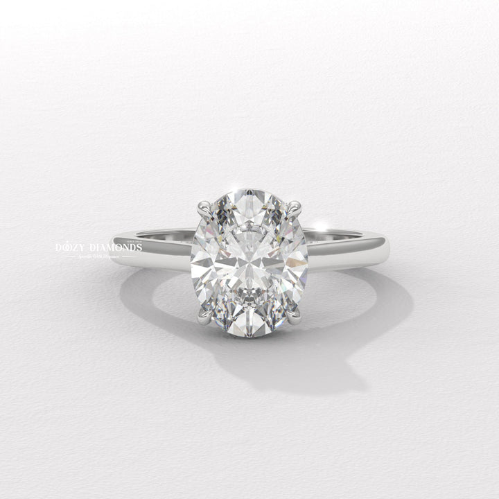 Close-up of oval cut center diamond in solitaire engagement ring