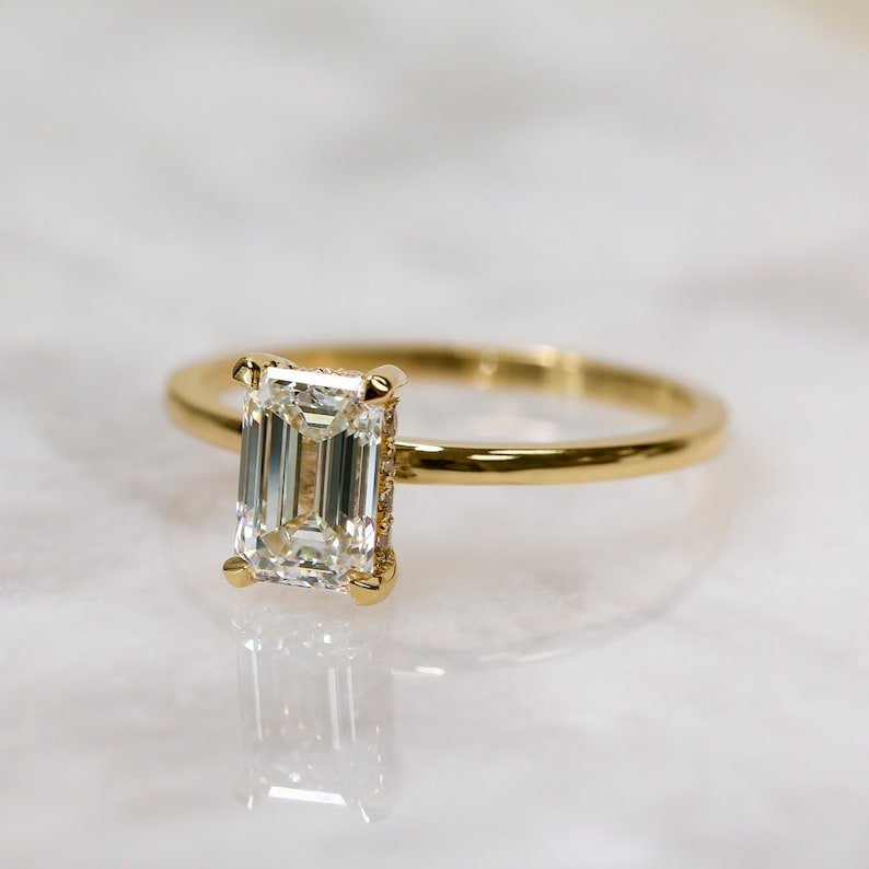 Emerald hidden halo lab grown diamond ring side profile in gold setting