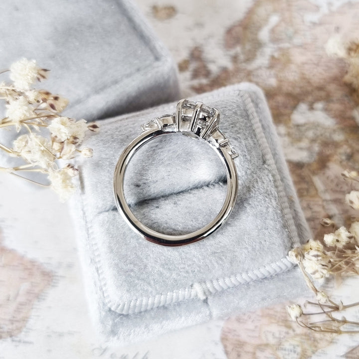 Round cut engagement ring shown with authenticity certificate