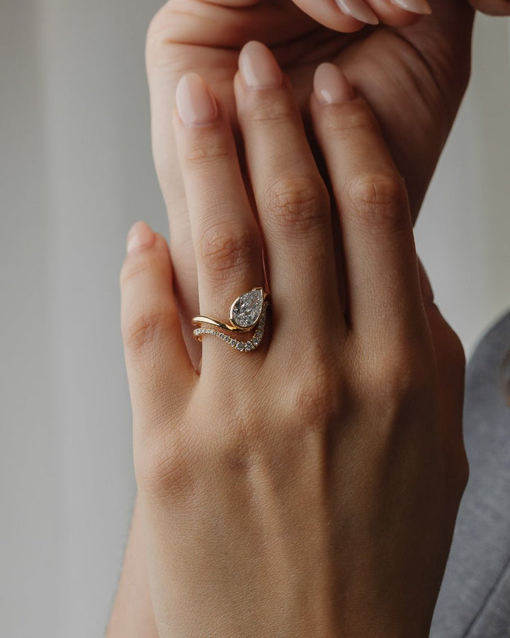 Certified pear cut diamond featured in solitaire engagement ring