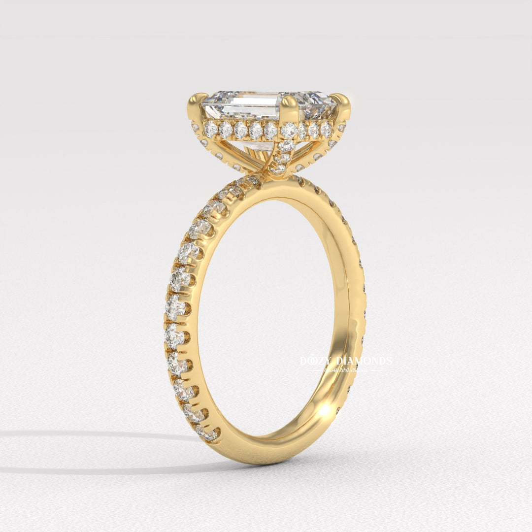 Emerald hidden halo engagement ring offered in gold and platinum