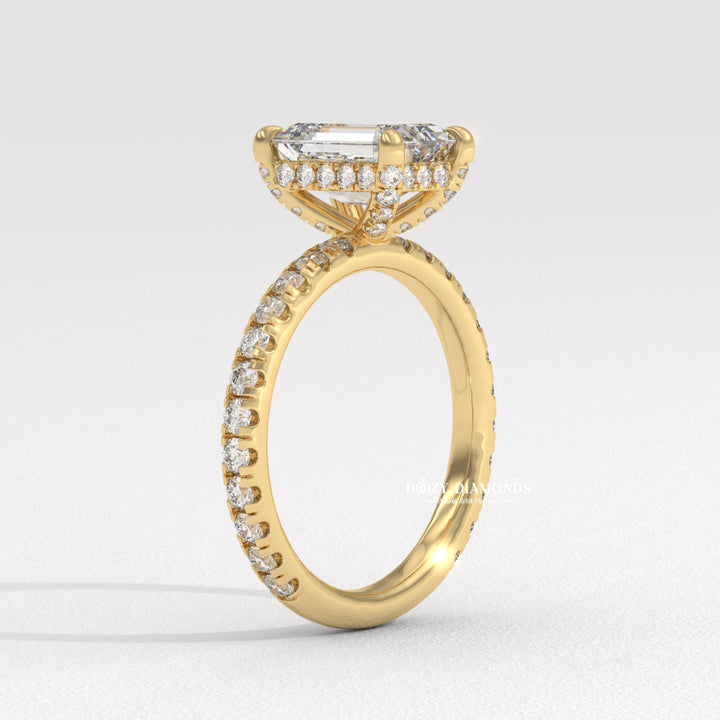 Emerald hidden halo engagement ring offered in gold and platinum