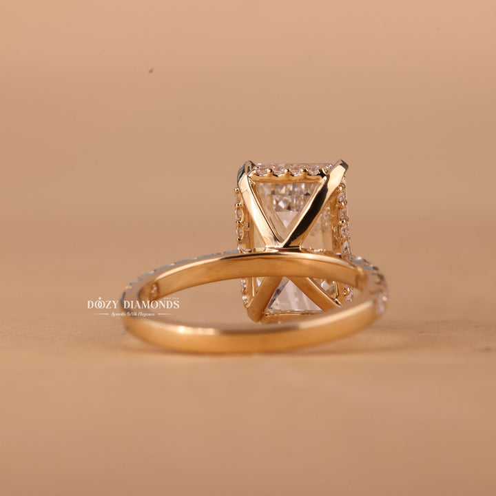 Unboxing view of emerald cut hidden halo diamond engagement ring
