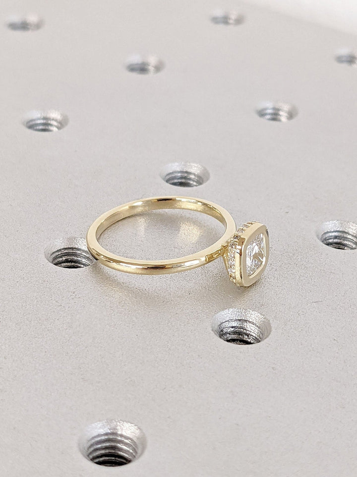 Cushion hidden halo engagement ring with brilliant diamond sparkle