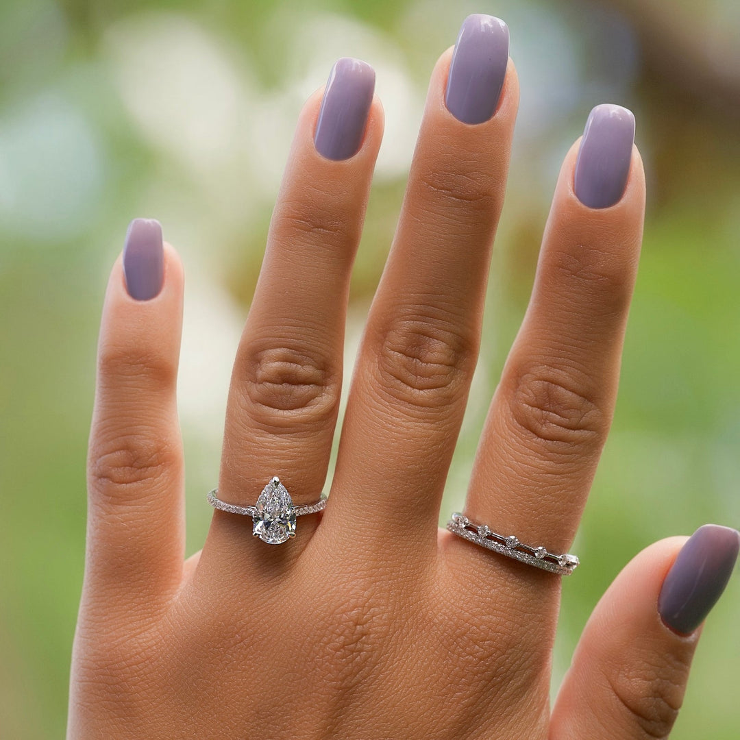 Angled view of pear cut diamond in hidden halo setting