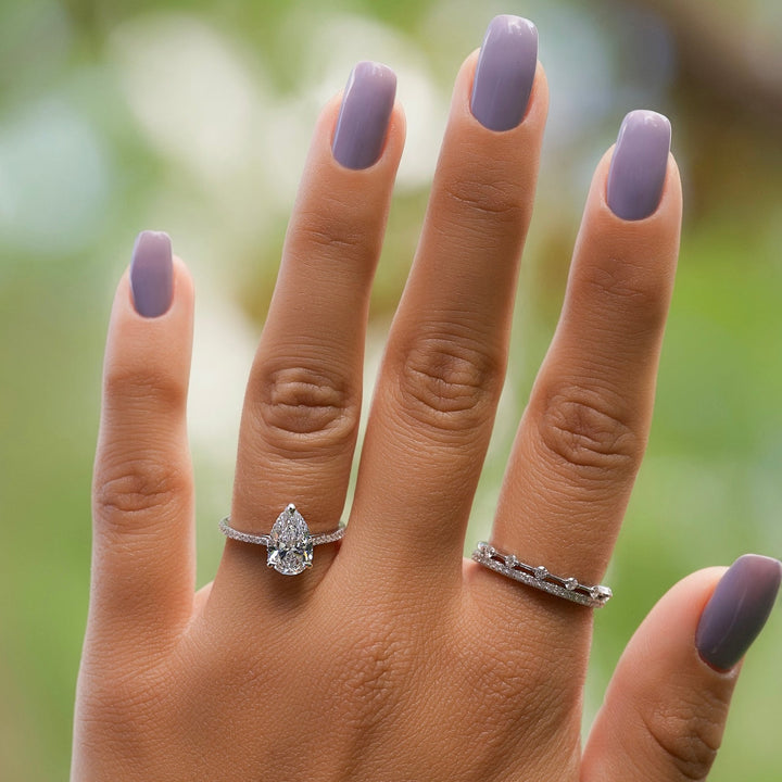 Angled view of pear cut diamond in hidden halo setting