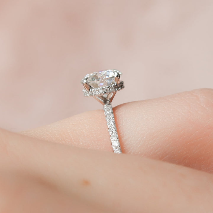 Angled view of round cut diamond in hidden halo setting