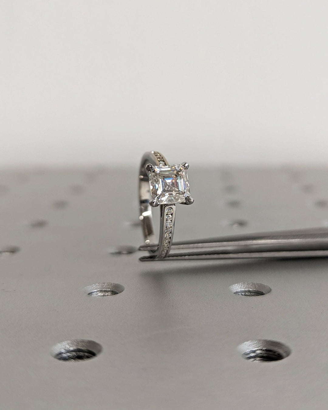 Asscher solitaire engagement ring viewed from the side