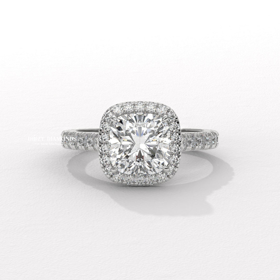 Macro shot of cushion cut diamond facets in halo ring setting