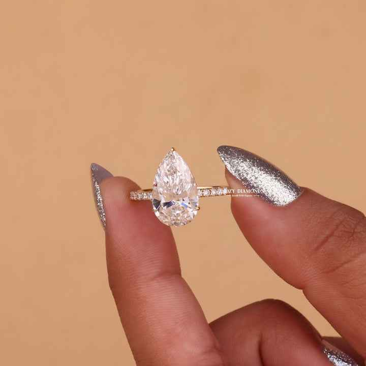 Side angle of pear hidden halo diamond engagement ring