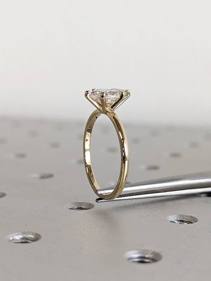 Marquise cut diamond ring worn on hand