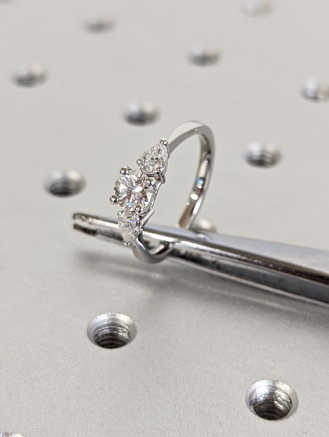 Side angle of round solitaire diamond engagement ring