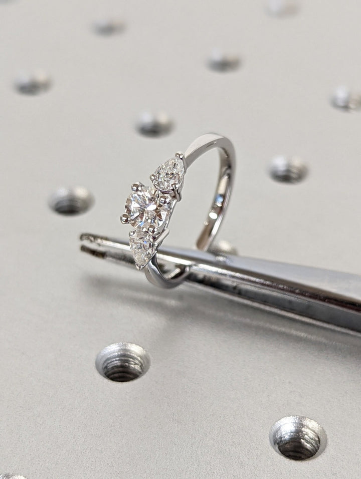Side angle of round solitaire diamond engagement ring