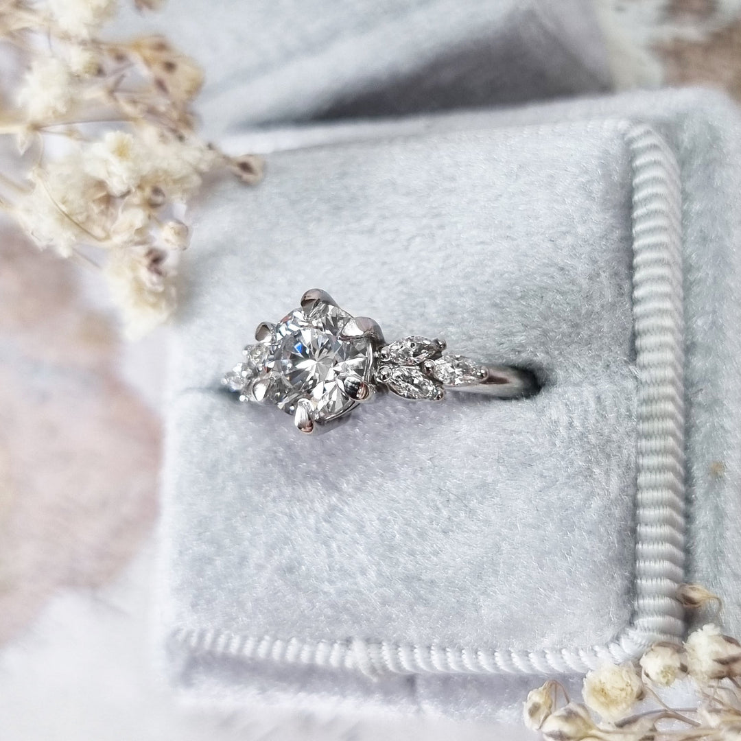 Round cluster diamond ring presented in signature gift packaging