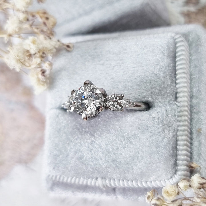 Round cluster diamond ring presented in signature gift packaging