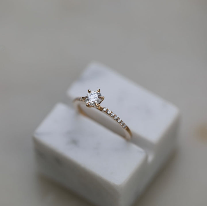 Fine craftsmanship detail on round solitaire engagement ring