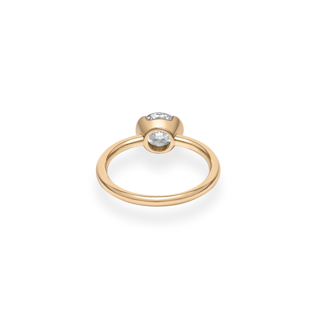 Round bezel engagement ring close-up highlighting diamond sparkle