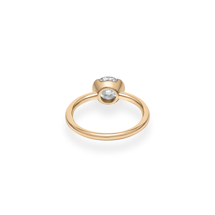 Round bezel engagement ring close-up highlighting diamond sparkle